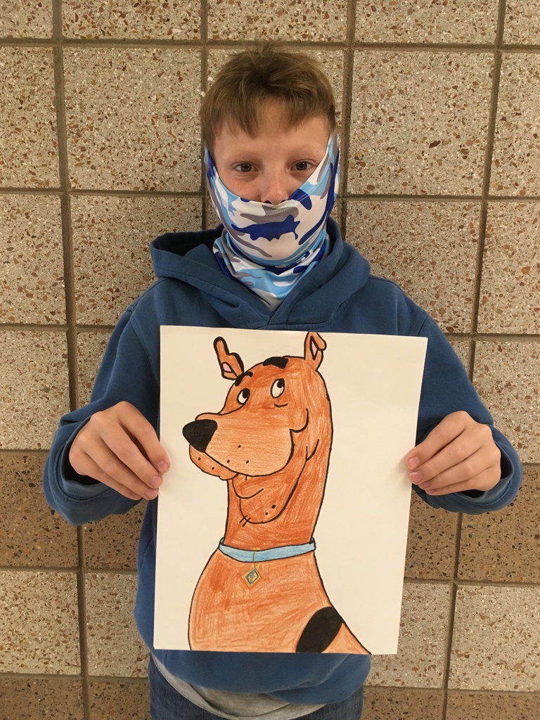 male student with his drawing of Scooby Doo