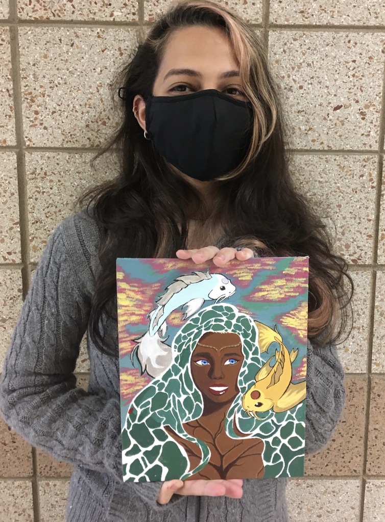 female student with an acrylic painting 