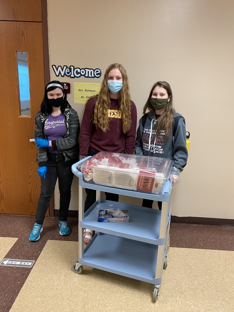 3 female students with a cart