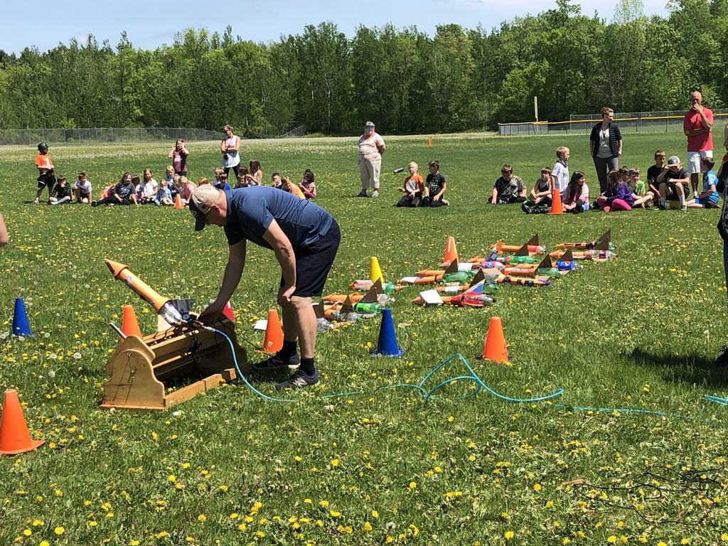 teacher launching a rocket