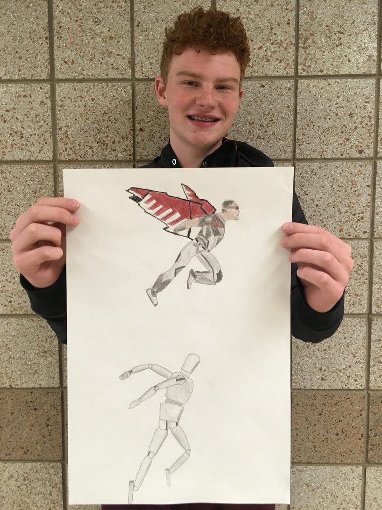 male student holding a drawing