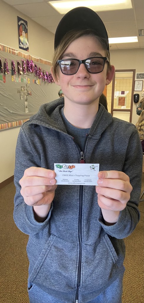 male student with a gift certificate