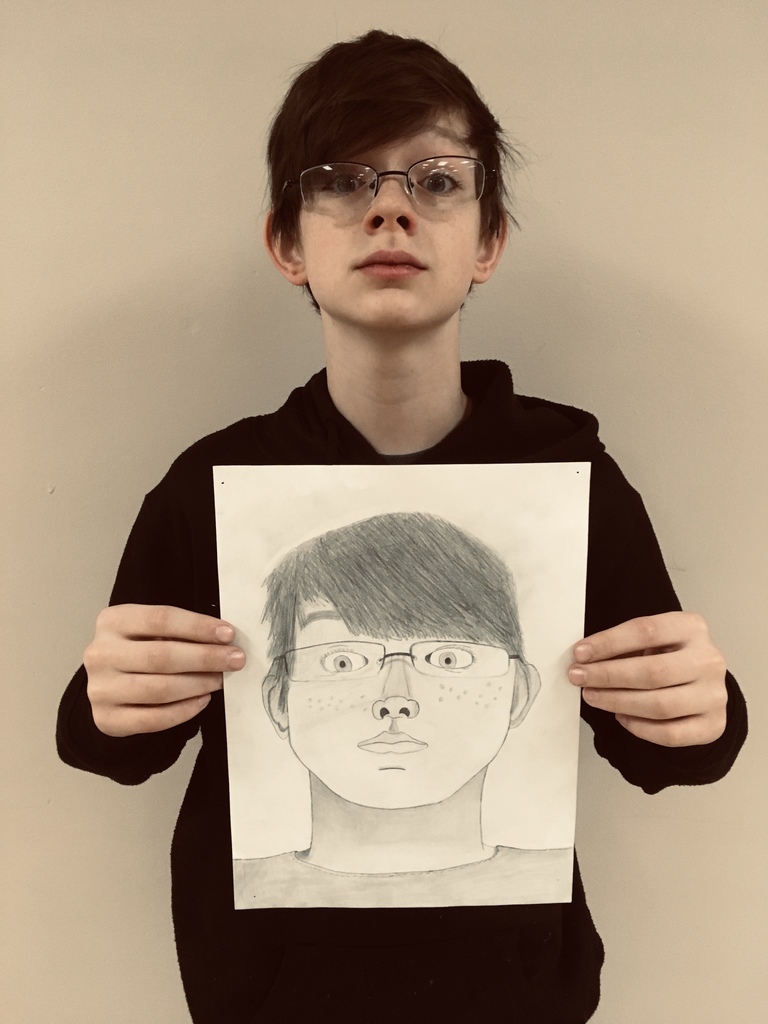 male student posing with his self portrait