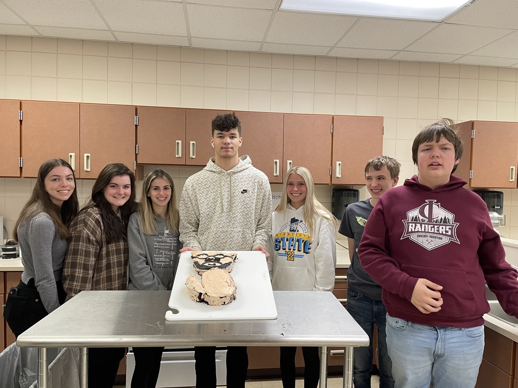students around a cake