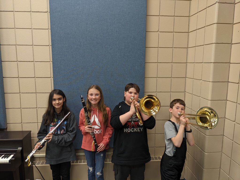 students holding their instruments