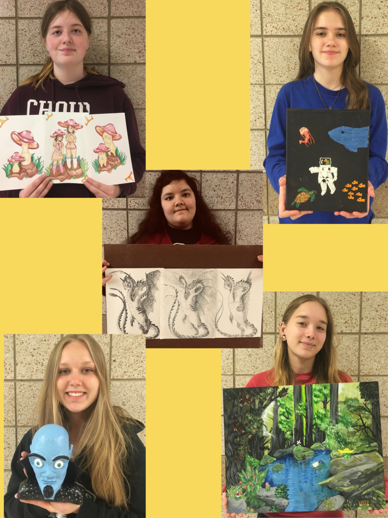 students holding art with yellow background