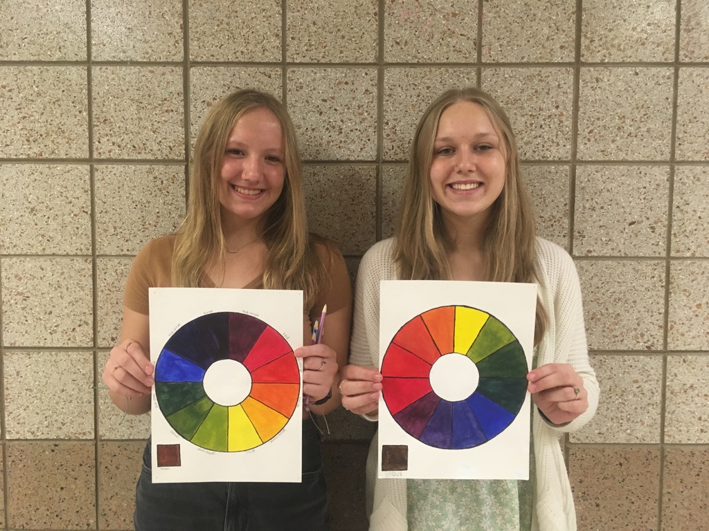 two students with a color wheel