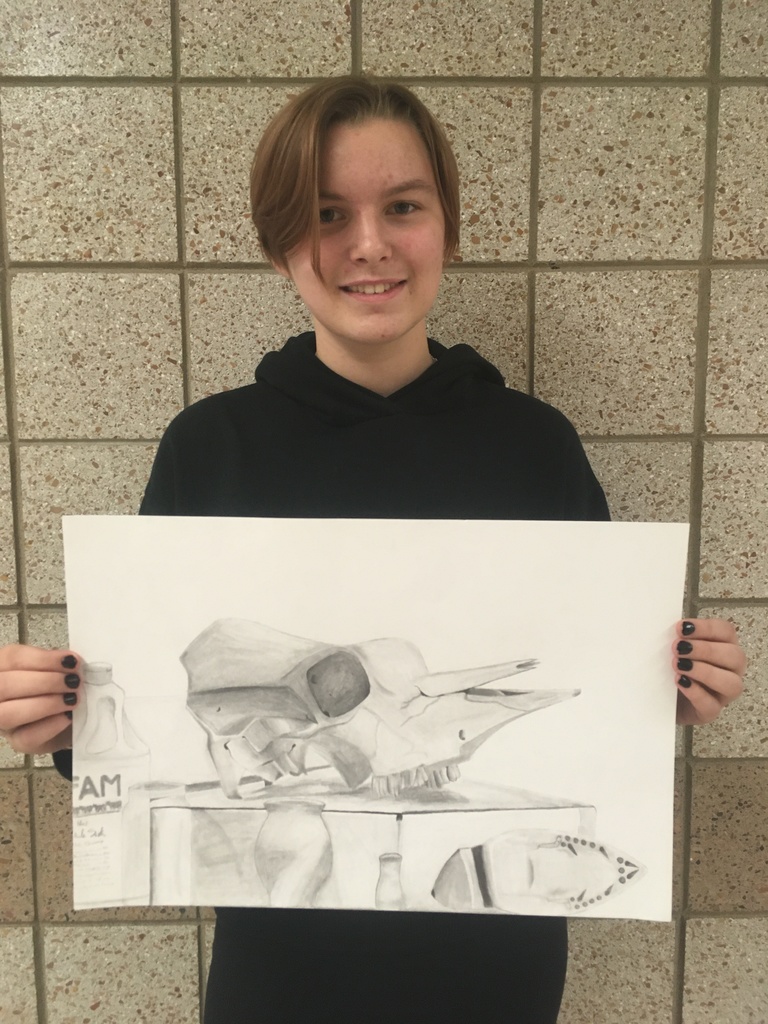 student with still life drawing