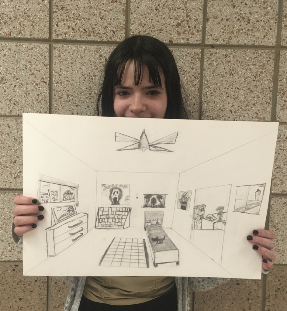 student holding perspective drawing