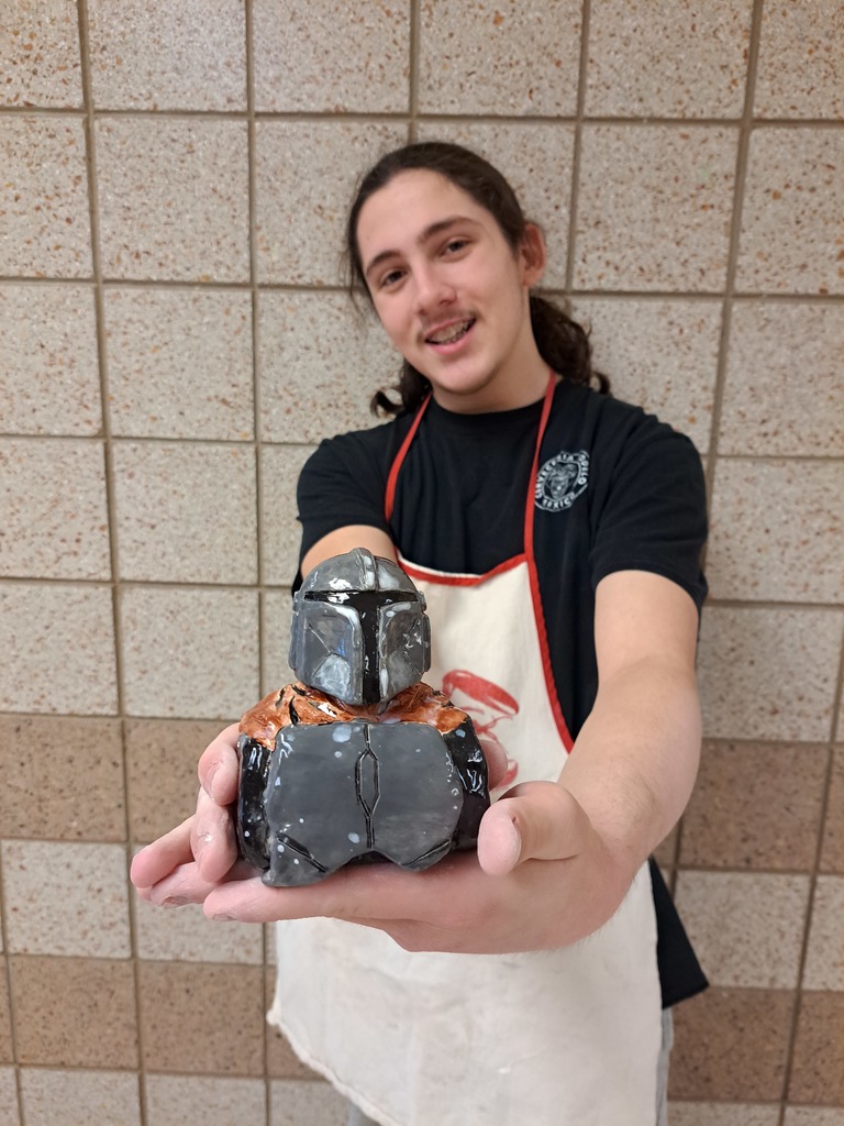 male student holding a 3D  knight