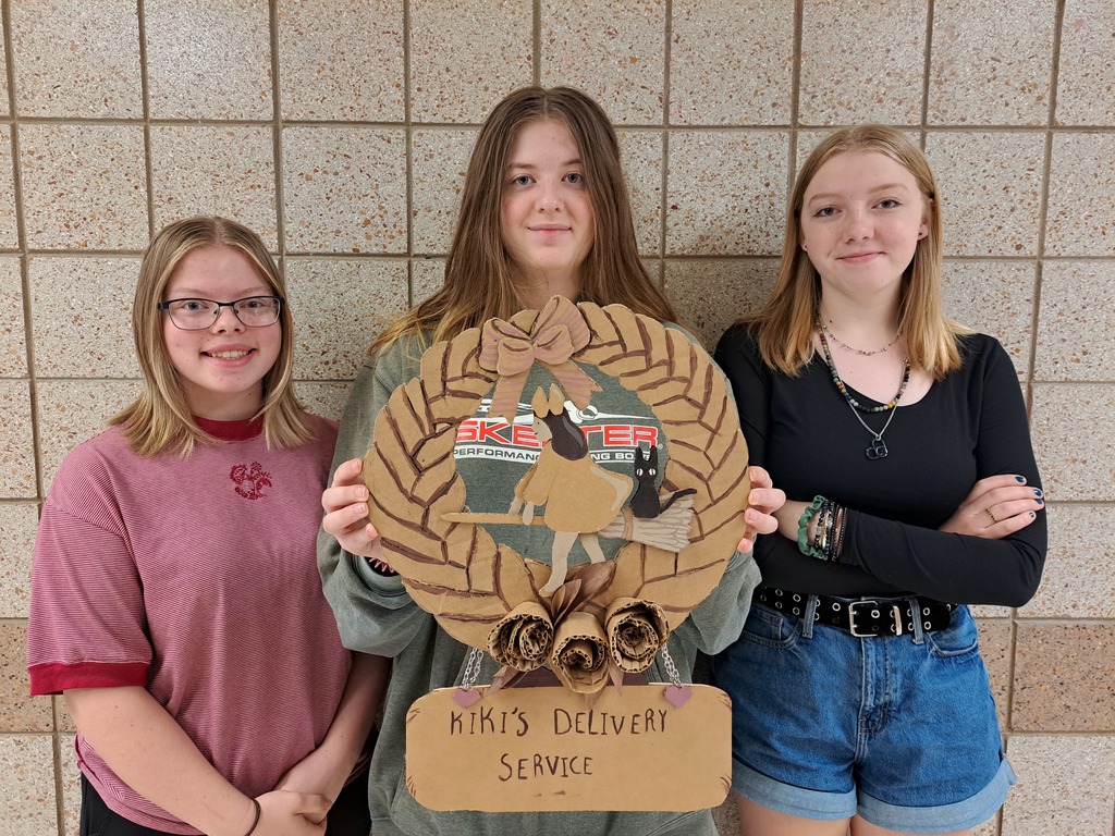students with cardboard art