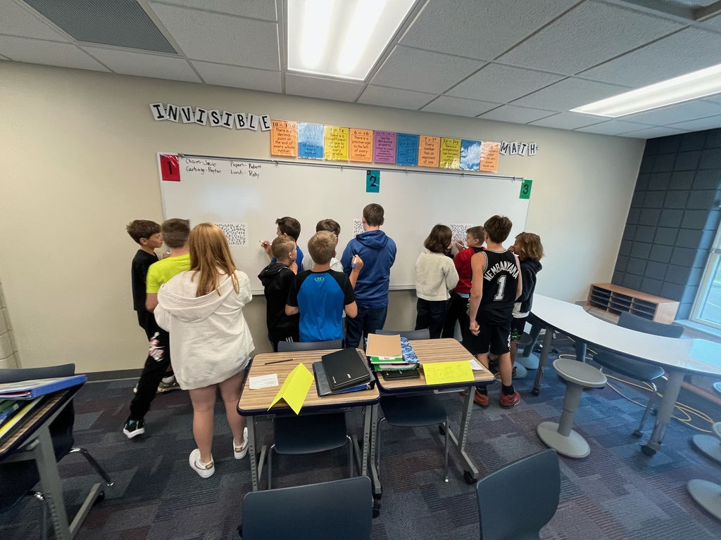 students at a whiteboard