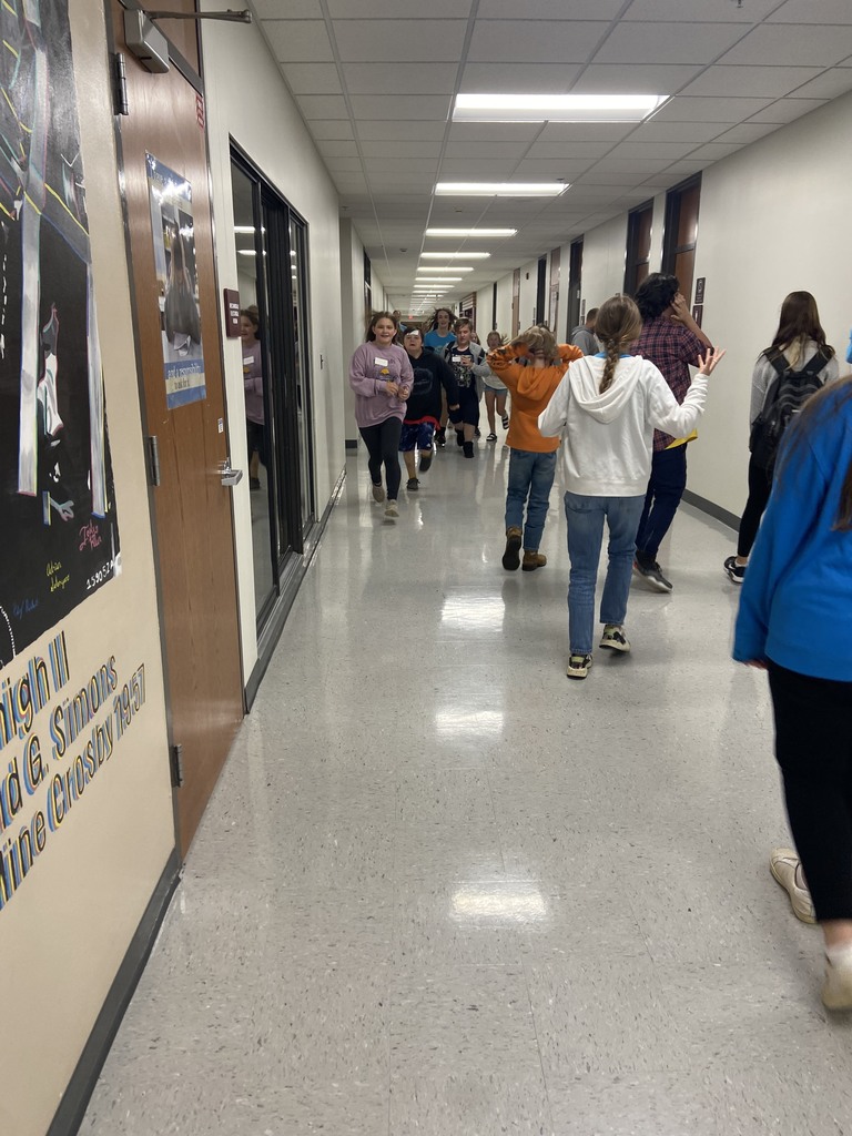 students walking down the hallway