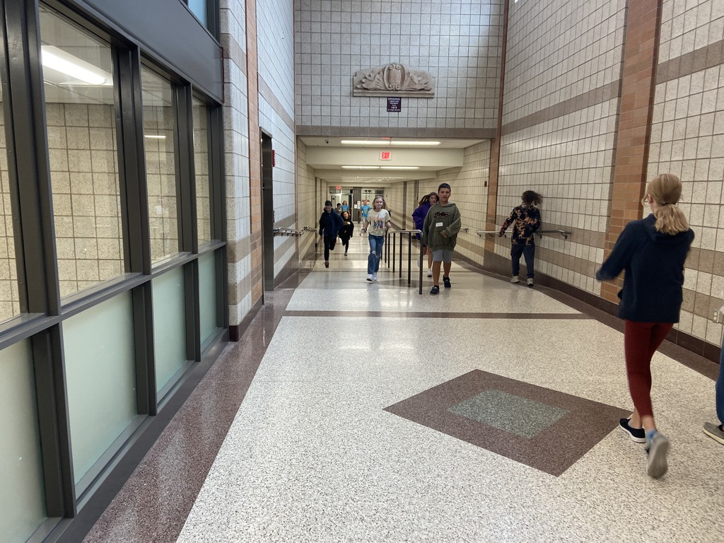 students walking through the hallway