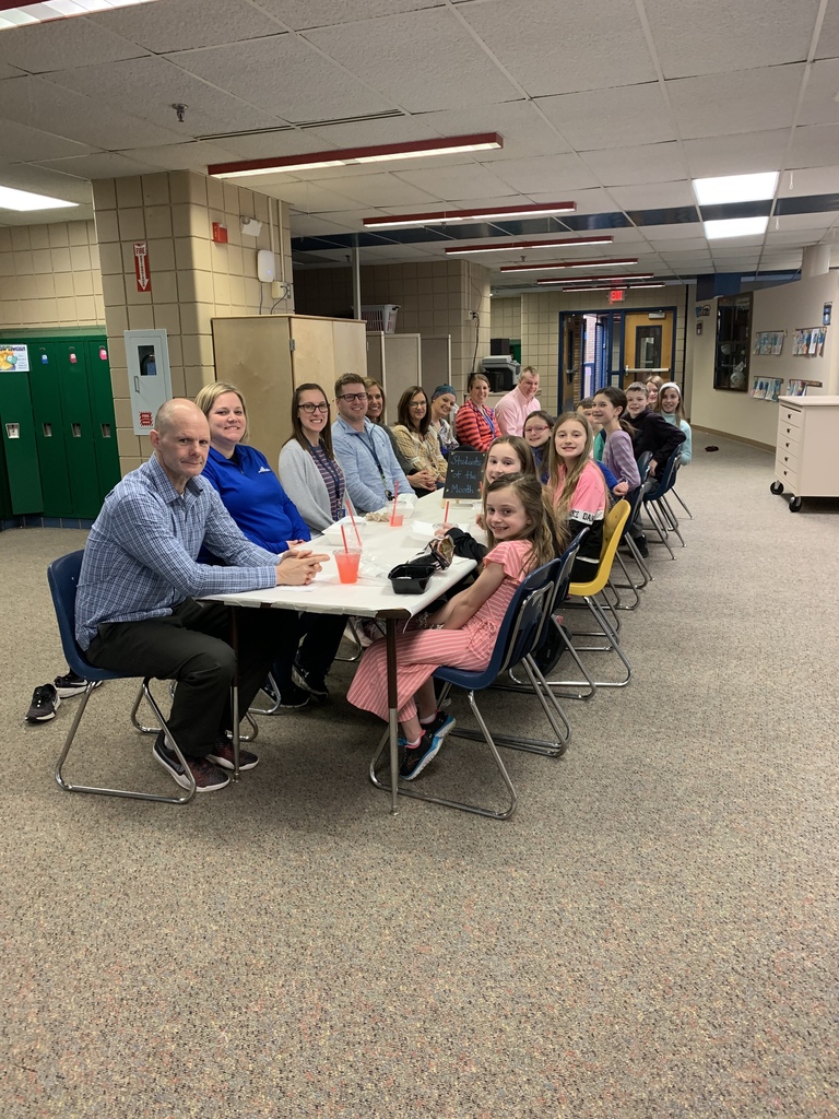 Students with their teachers at lunch