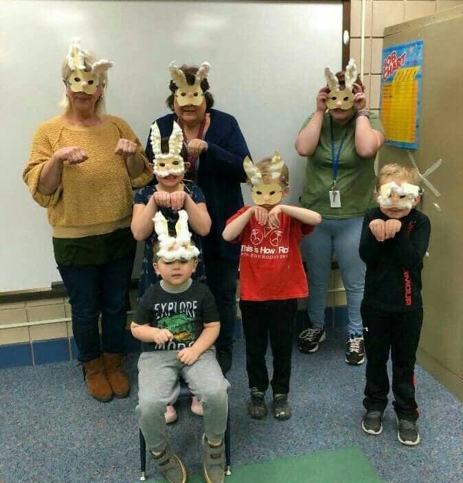 staff and students in bunny masks